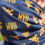 WVU gaiter on face
